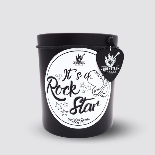 Kerze It`s a Rockstar Junge blau vor hellem Hintergrund
